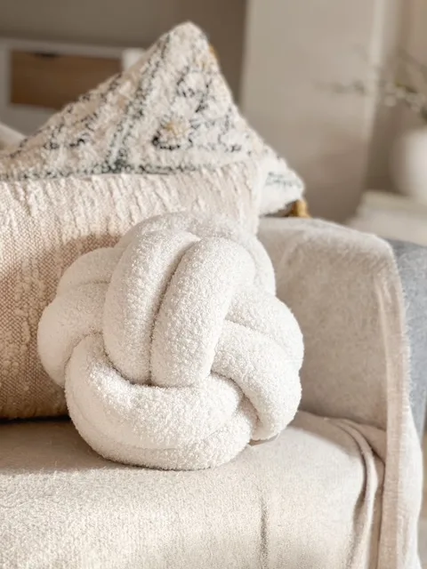 Large cream Nordic boucle knot cushion