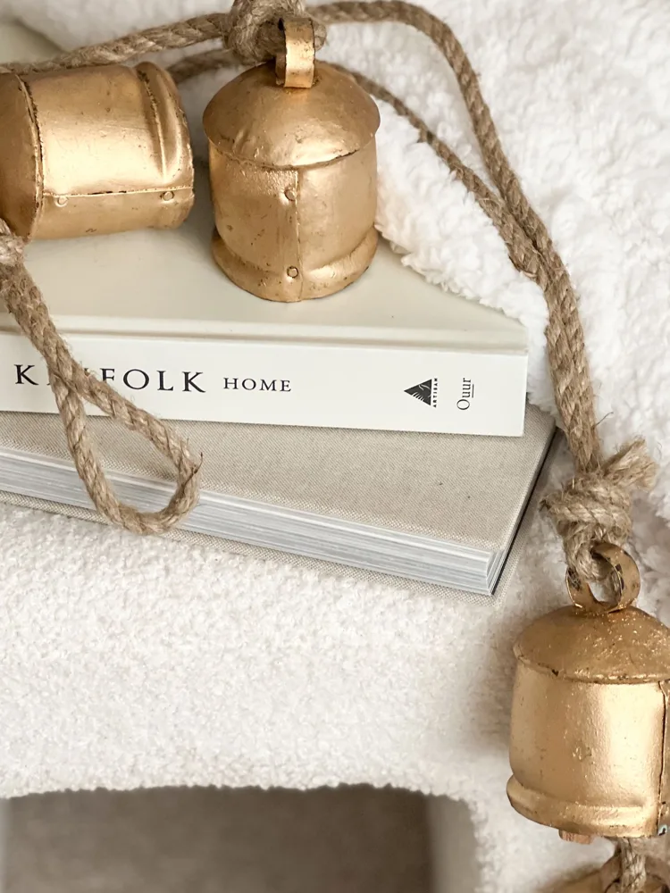 Four vintage style bells on hanging rope