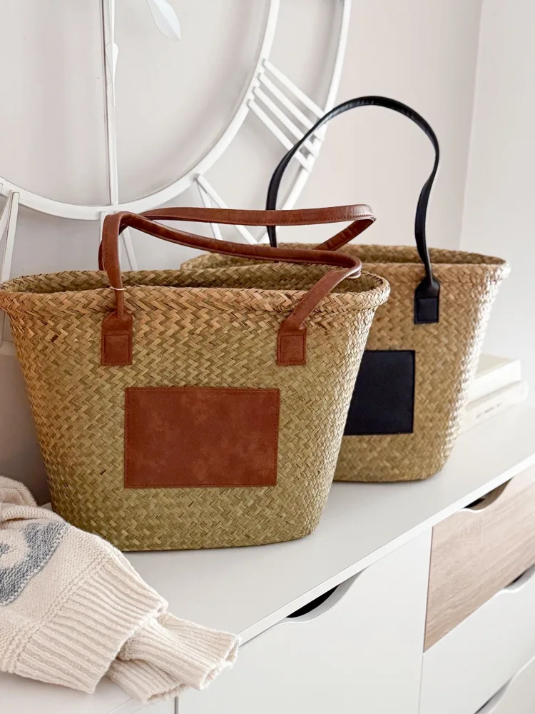Seagrass basket bag with tan panel and handles