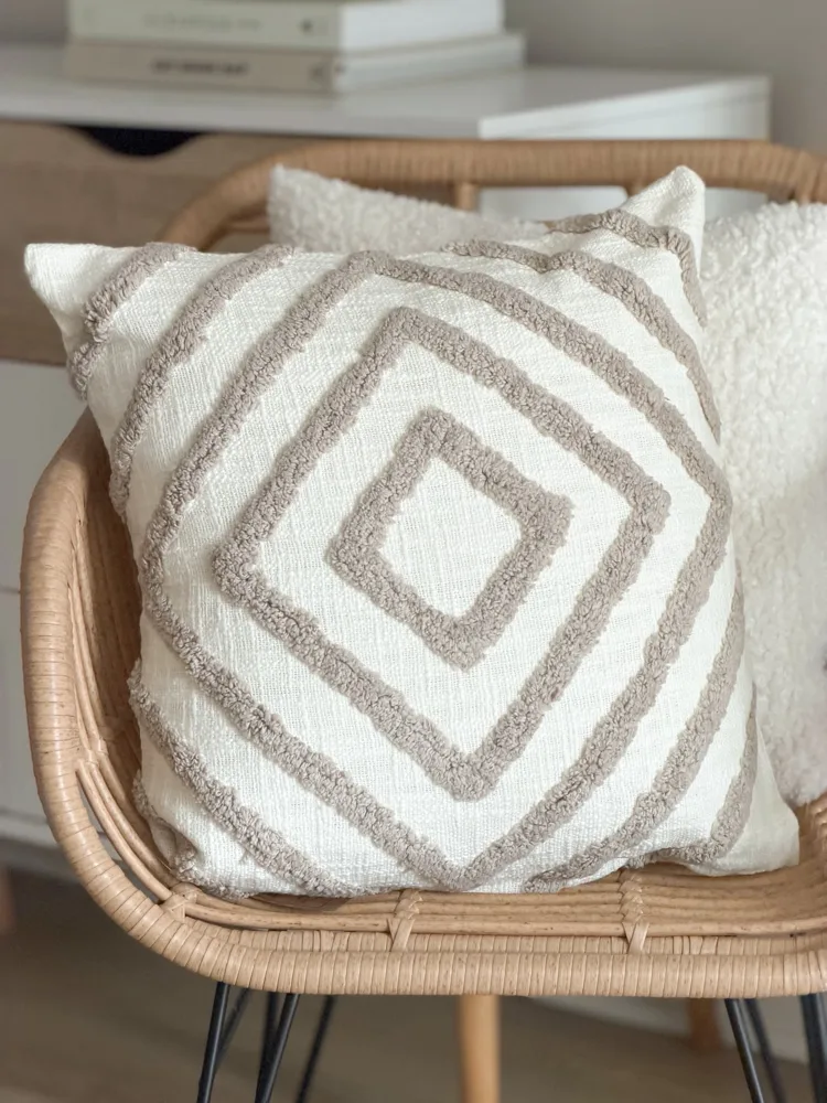 Tufted textured taupe cushion