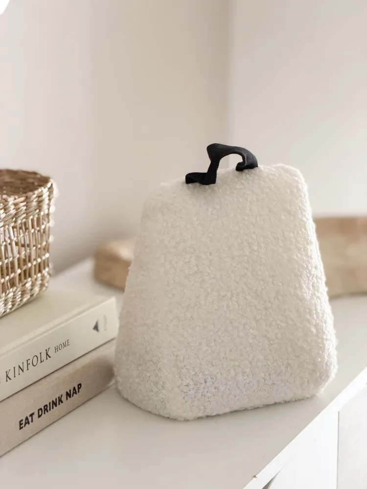 Cream boucle door stop with handle