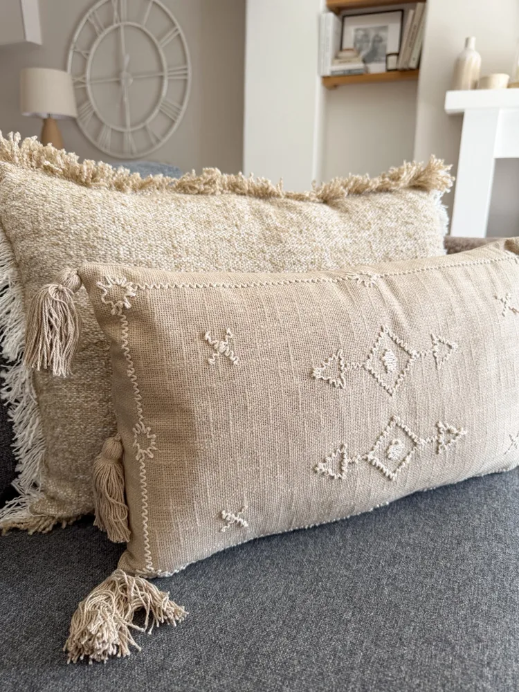 Decorative stitch stone cushion with tassels