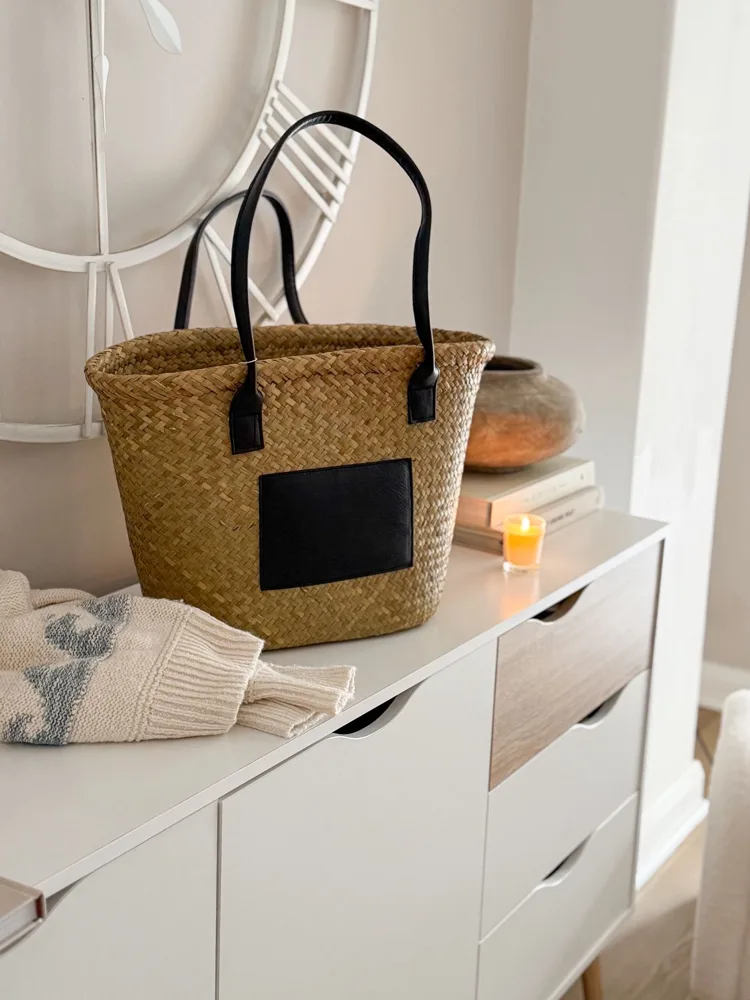 Seagrass basket bag with matt black panel and handles