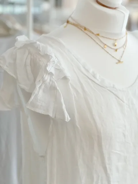 White linen ruffle shoulder tunic dress