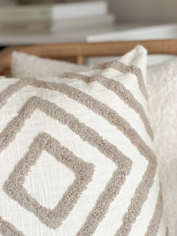 Tufted textured taupe cushion