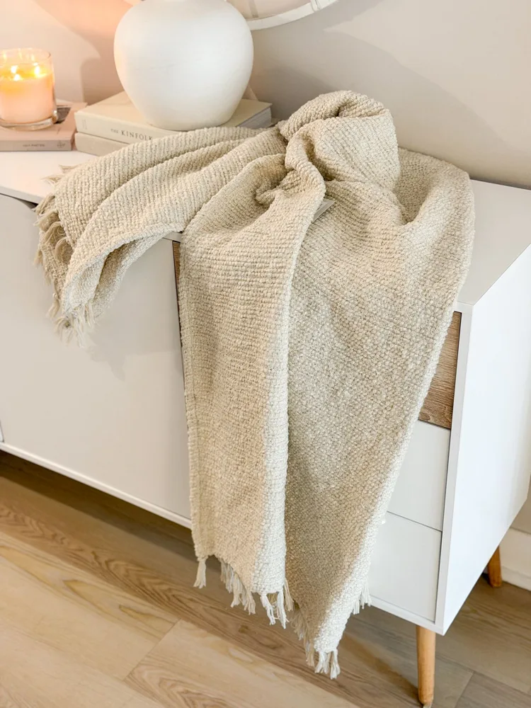 Textured tassel boucle throw in ecru