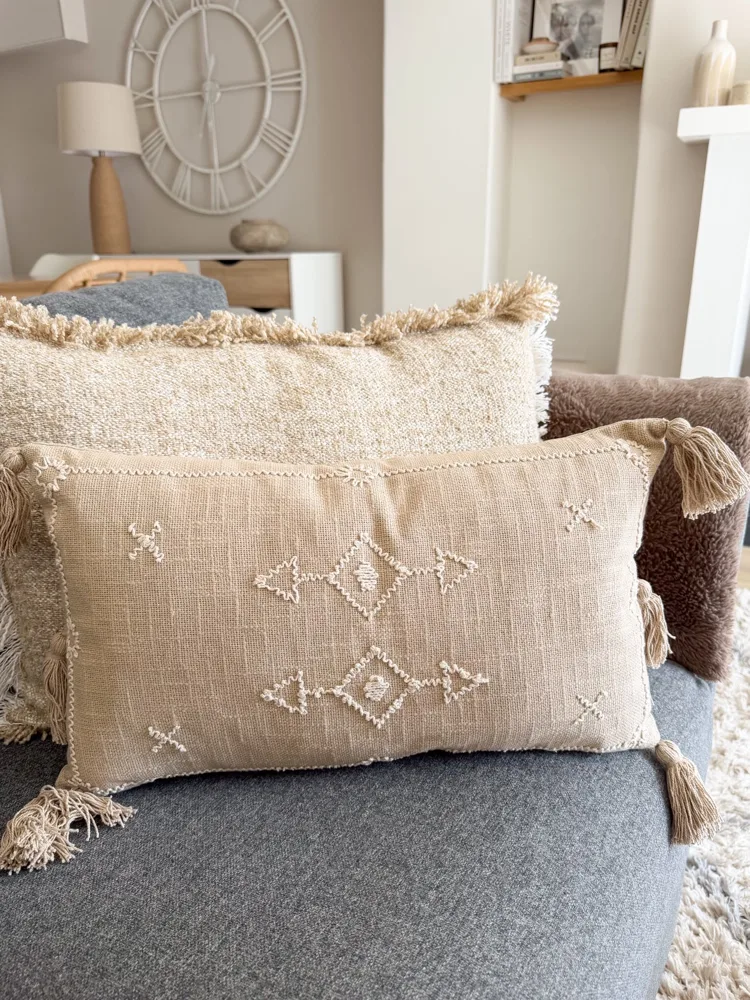 Decorative stitch stone cushion with tassels