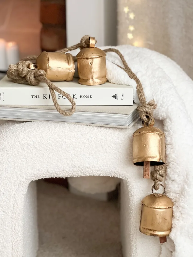 Four vintage style bells on hanging rope
